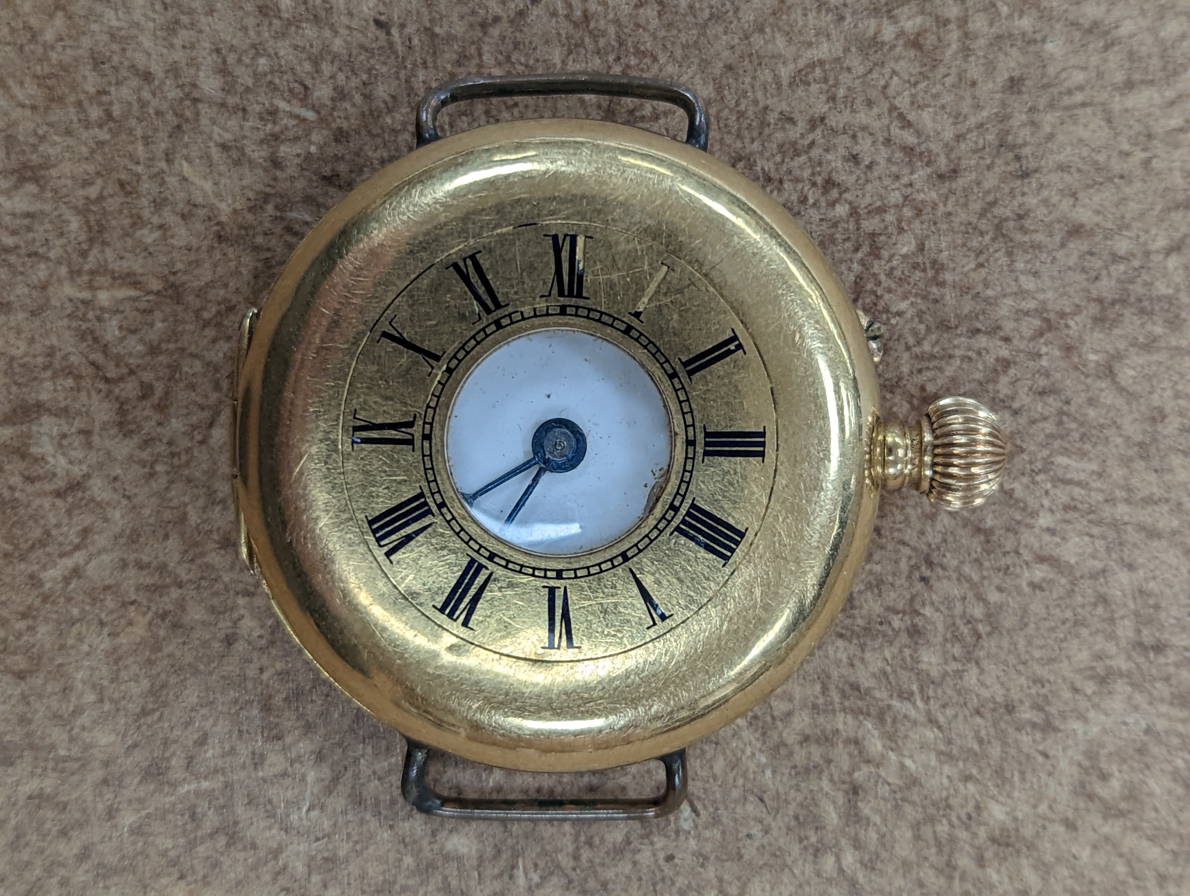 A gentleman's early 20th century continental 18k half hunter wrist watch, case diameter 33mm, gross weight 32.7 grams, together with two other silver watches.